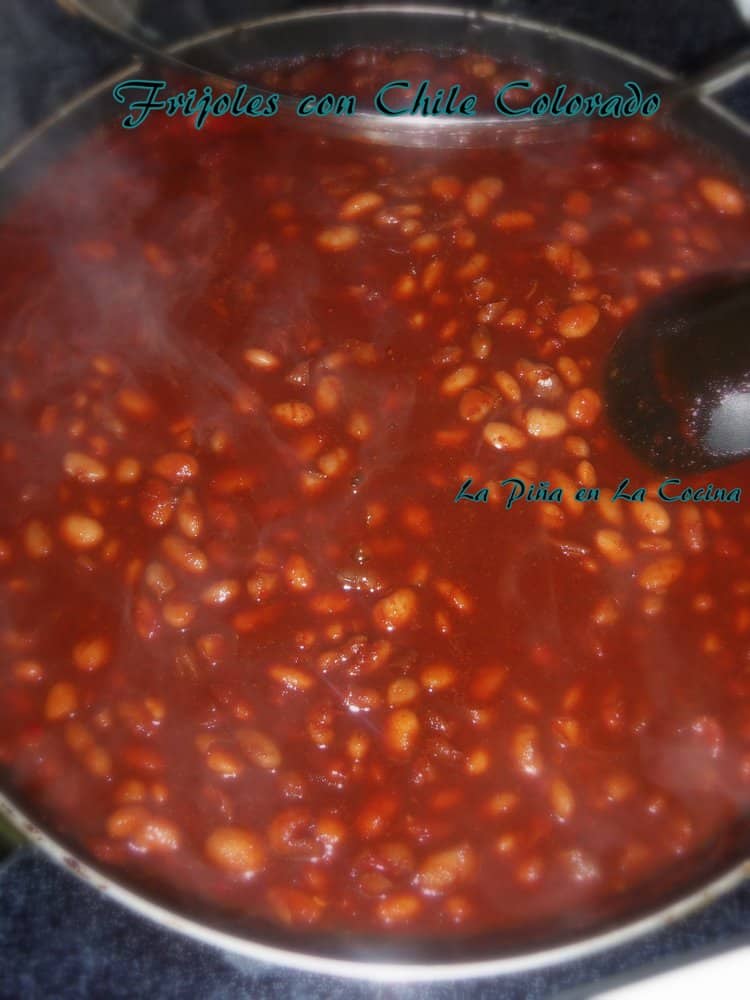 pinto beans with chile ancho sauce and bean broth simmering