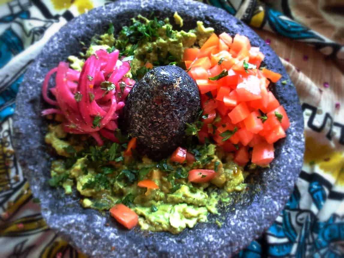 In many restaurants in Mexico they serve up the guacamole this way. This allows you to add in your favorite ingredients.