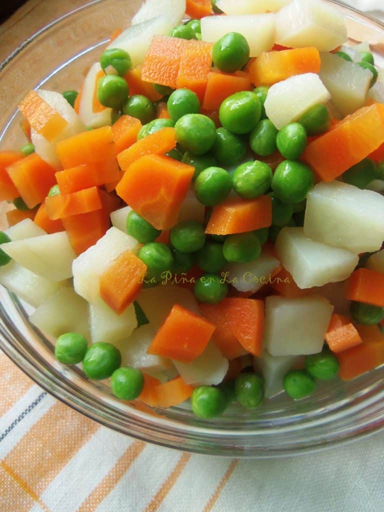 Ensalada de Pollo, Peas, Carrots and Potatoes in a bowl