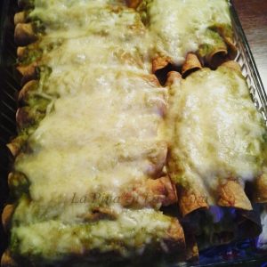 Smothered green chile chicken taquitos