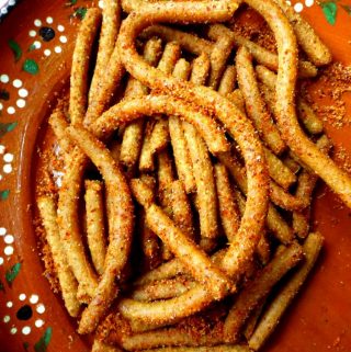 fried churritos on mexican plate