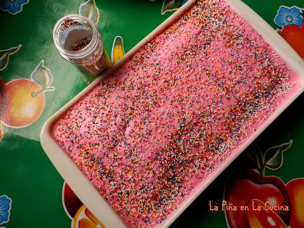 Cortadillo cake in the pan with sprinkles on the side