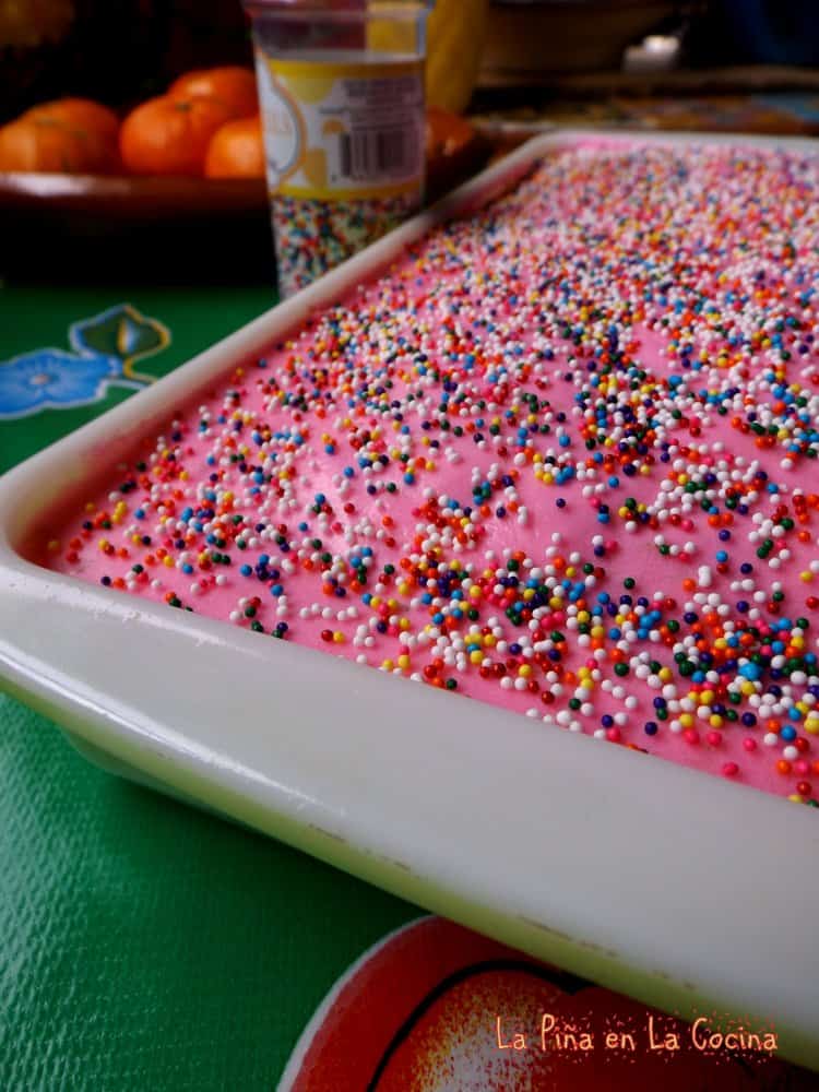 Pink cake with sprinkles in the pan