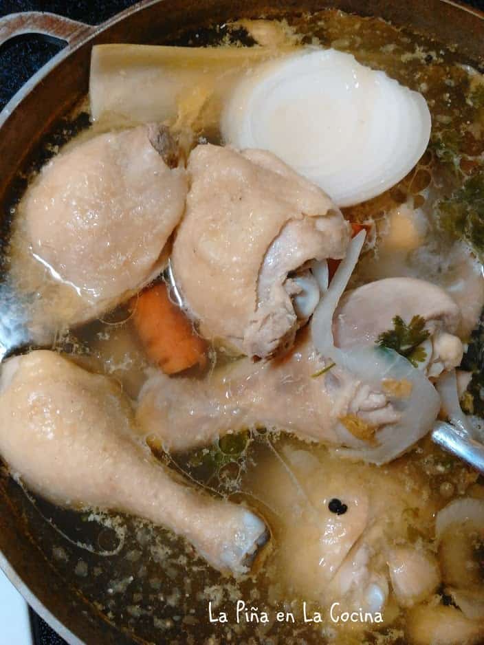 Chicken pieces cooking in water