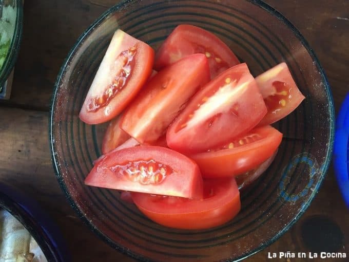 tomatoes sliced into  quarters in a bowl
