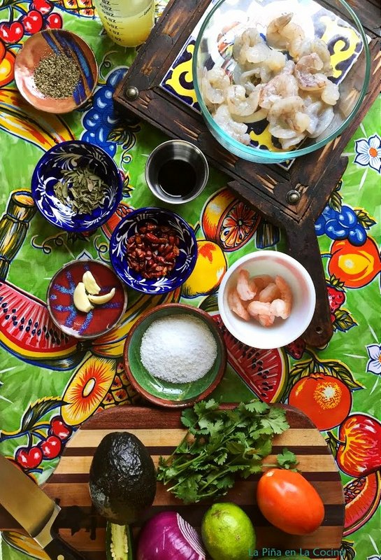 Ingredients for shrimp aguachile in individual bowls on the table