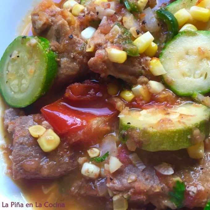 Close up of pork with zucchini and corn