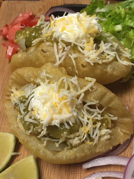 Two loaded chicken puffy tacos