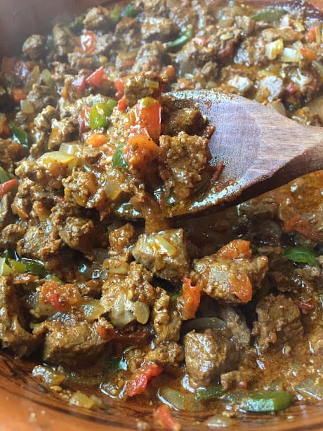 spicy marinated beef in pot close-up
