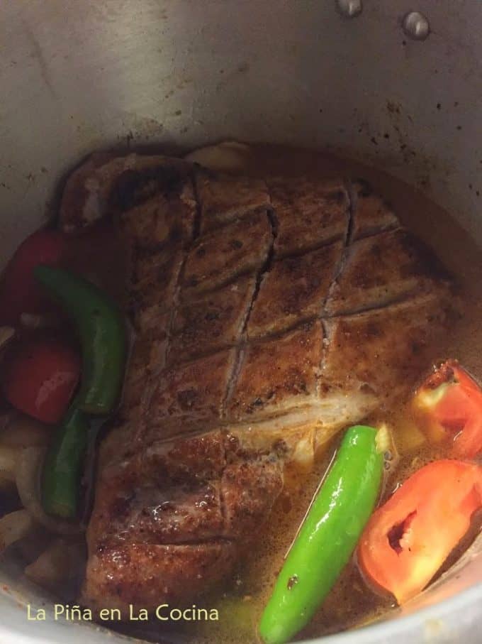 Seared suadero beef with tomatoes, serrano peppers, onions, garlic and broth in pressure cooker