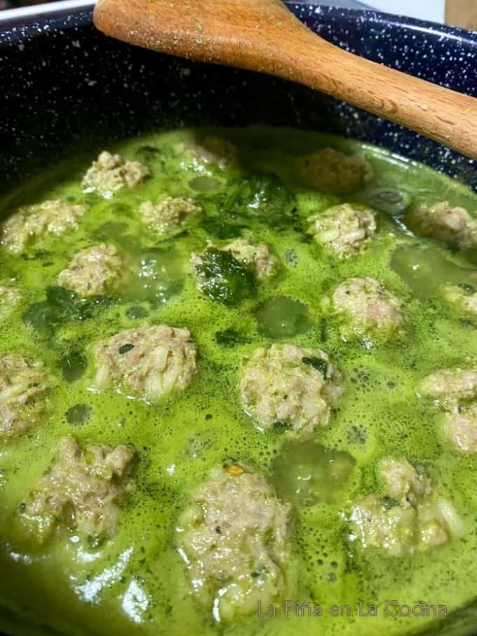 Simmering meatballs floating to the top