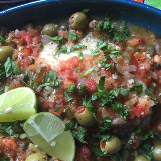 veracruz style fish with salsa over the top