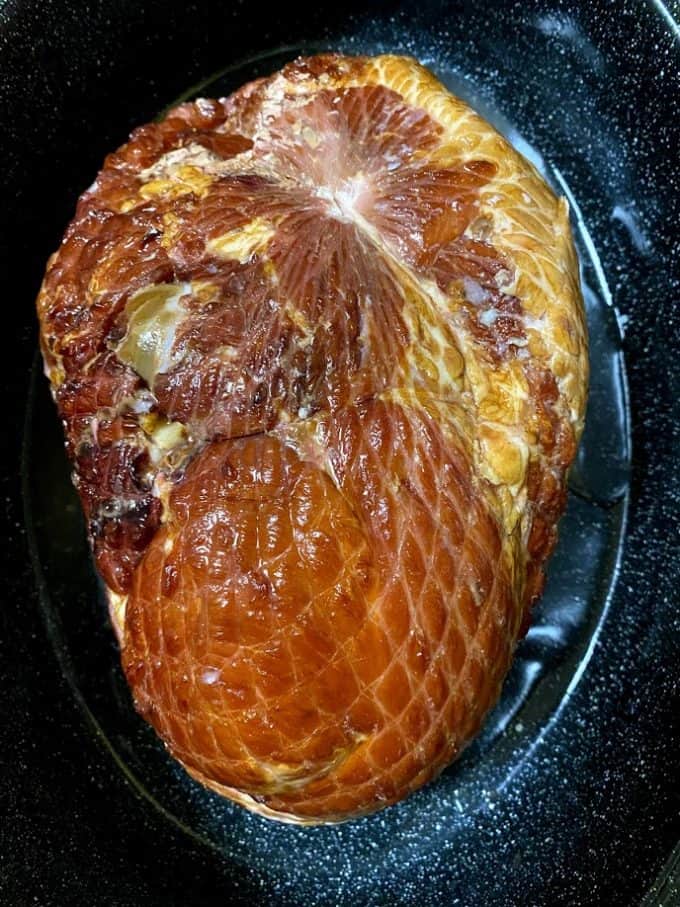 Spiral ham flat side down in the roasting pan
