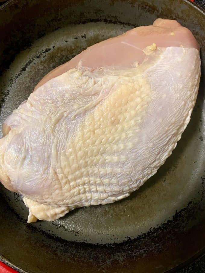 turkey breast before rubbing flavored butter all over the surface