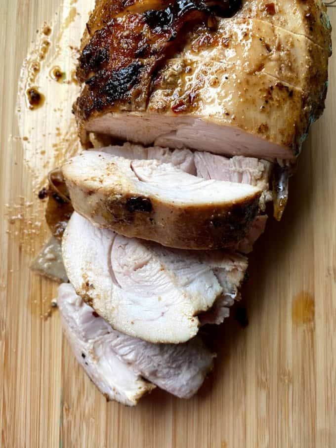 Sliced turkey breast on cutting board