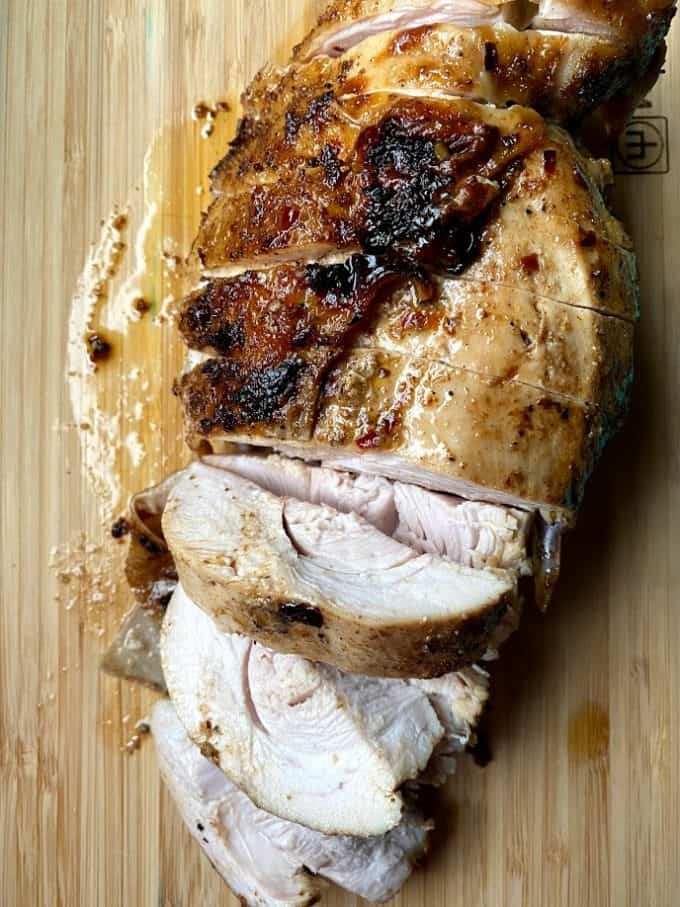 sliced turkey breast on cutting board