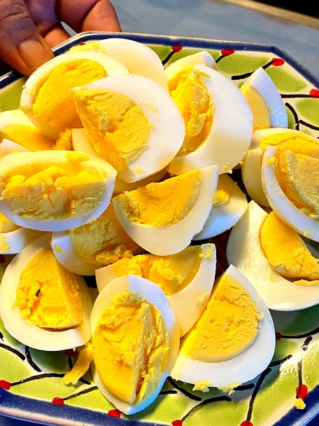 Hard boiled egg quarters on a plate