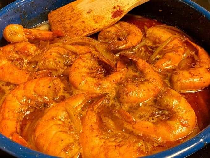 close up os spicy shrimp appetizer cooking in butter sauce