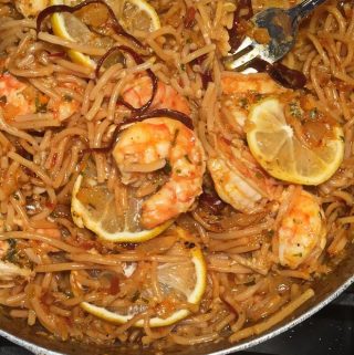 close up of fideo with shrimp in skillet