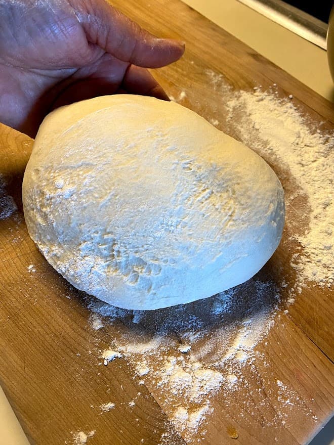 empanada dough on floured cutting board