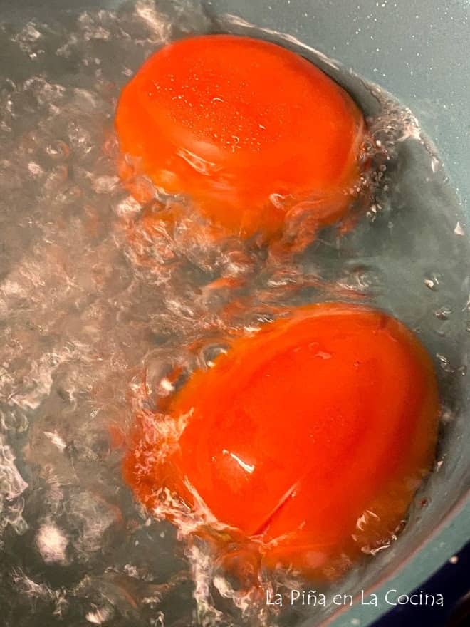 tomatoes boiling in water close up