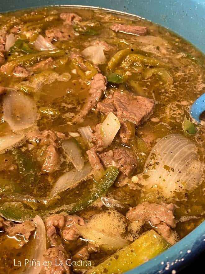 close up of beef with green chile in the pot