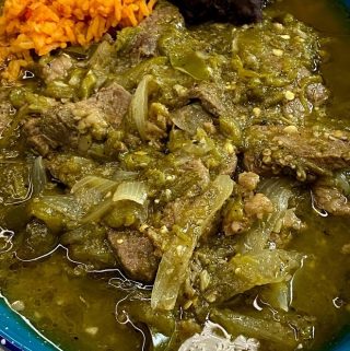 Close up of beef with green chile plated