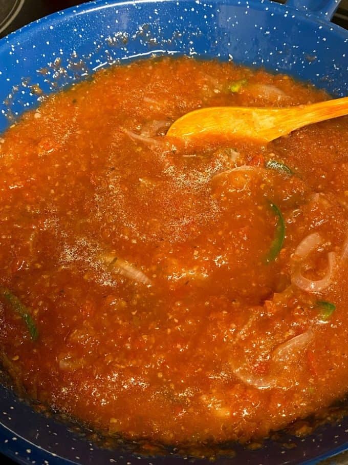 cantina style red salsa simmering in skillet