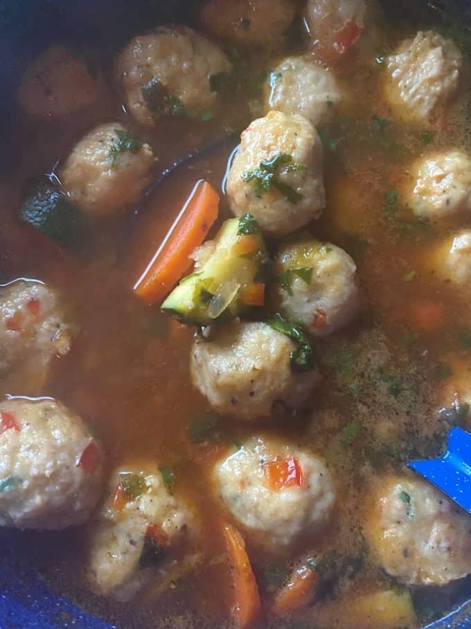 close up of shrimp meatballs in the pot with vegetables