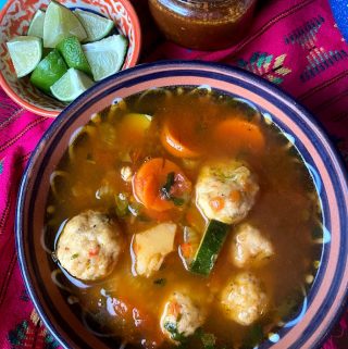 top view of shrimp meatballs with vegetables and broth