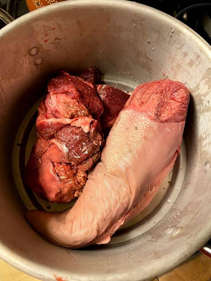 beef tongue and cheek inside steamer pot