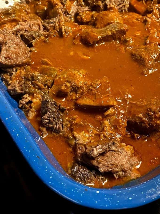 Barbacoa with some consomme added in baking dish