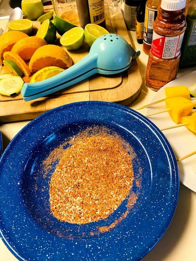 tajin chile lime seasoning mixed with salt in a shallow bowl