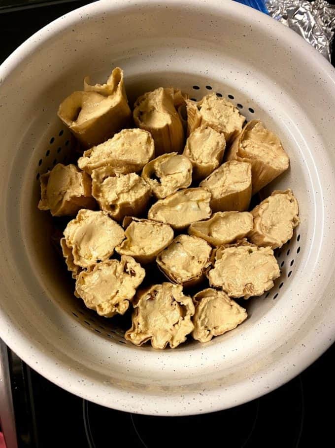 tamales arranged in steamer pot befor cooking