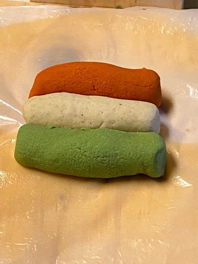 tri colored masa side by side in tortilla press