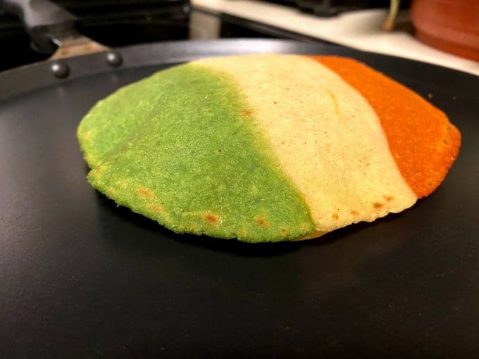 tortilla cooking on a nonstick griddle