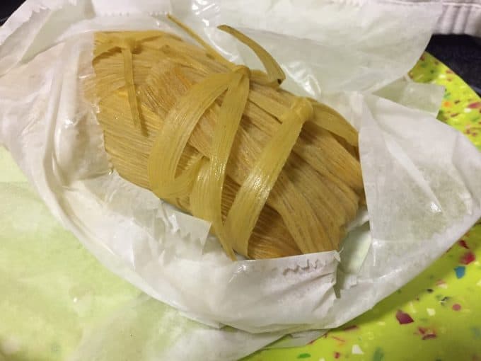 fresh tamal out of the steamer pot