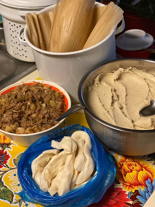 masa for tamales, beef filling, soft corn husk and oaxaca cheese