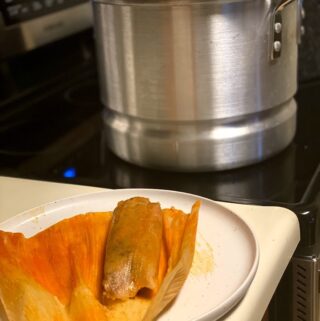 red chile pork tamal fresh out of the steamer pot