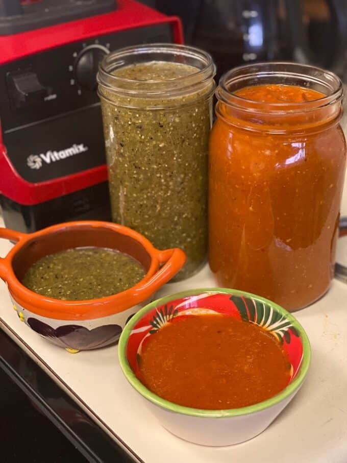 salsa roja and salsa verde in glass jars. Extra salsa in small bowls