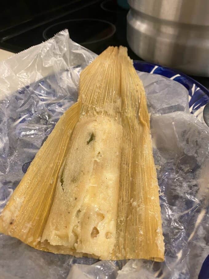 fresh tamal unwrapped on plate