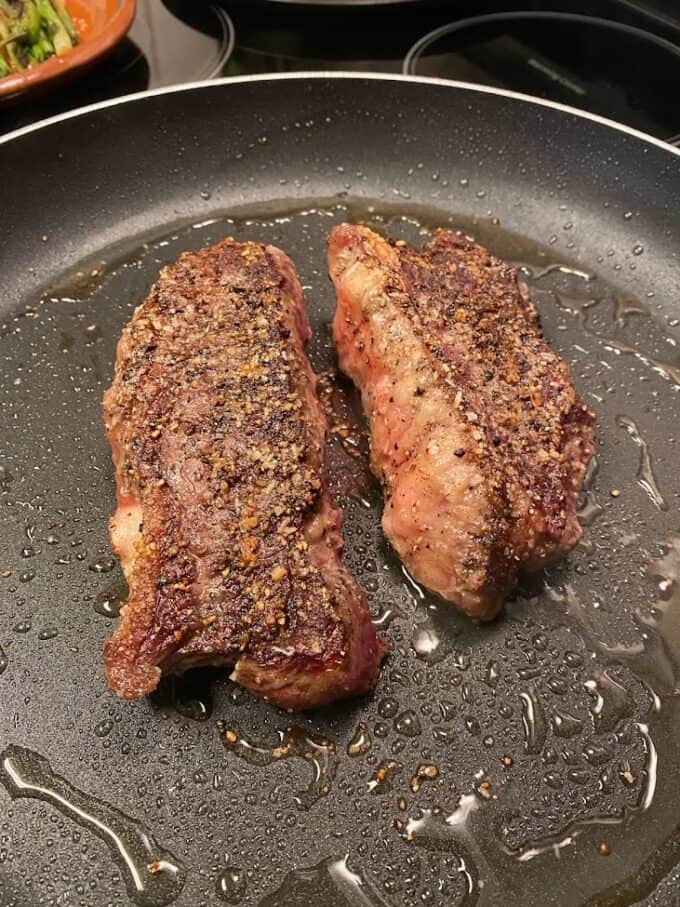 strip steaks in skillet