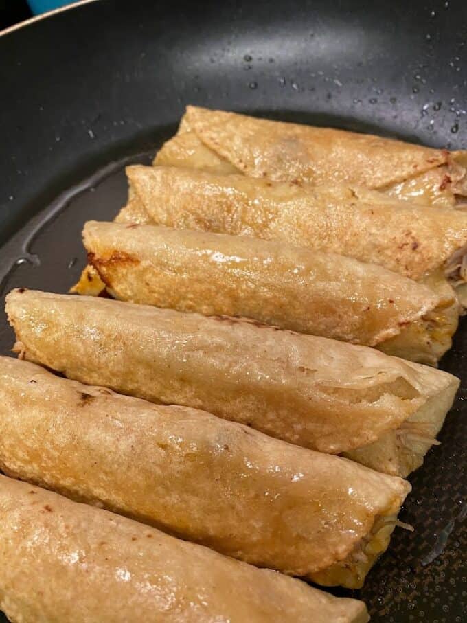 rolled enchiladas before adding the sauce in the skillet