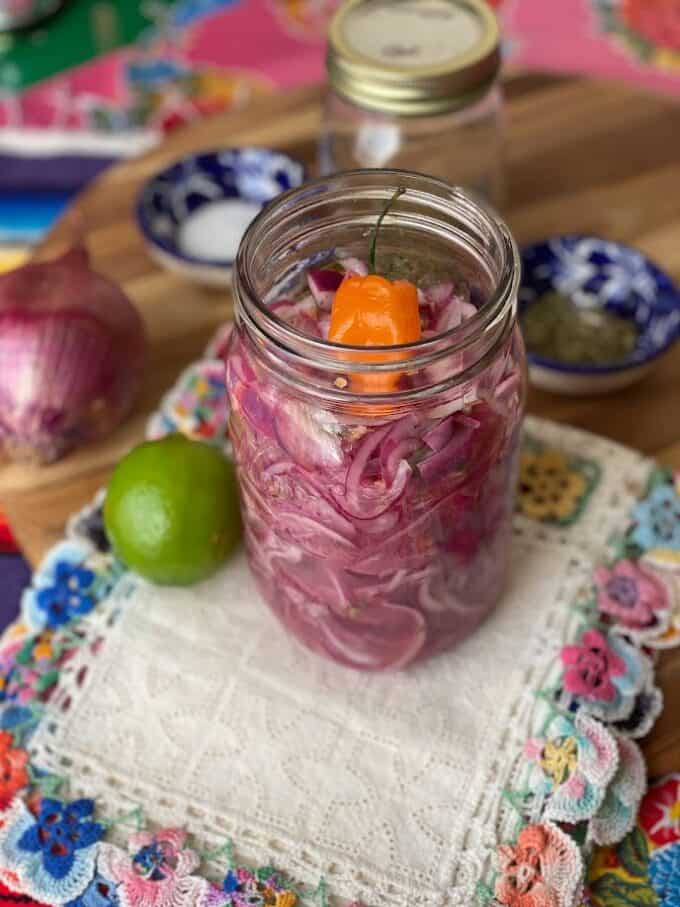 pickled red onions in glass jar