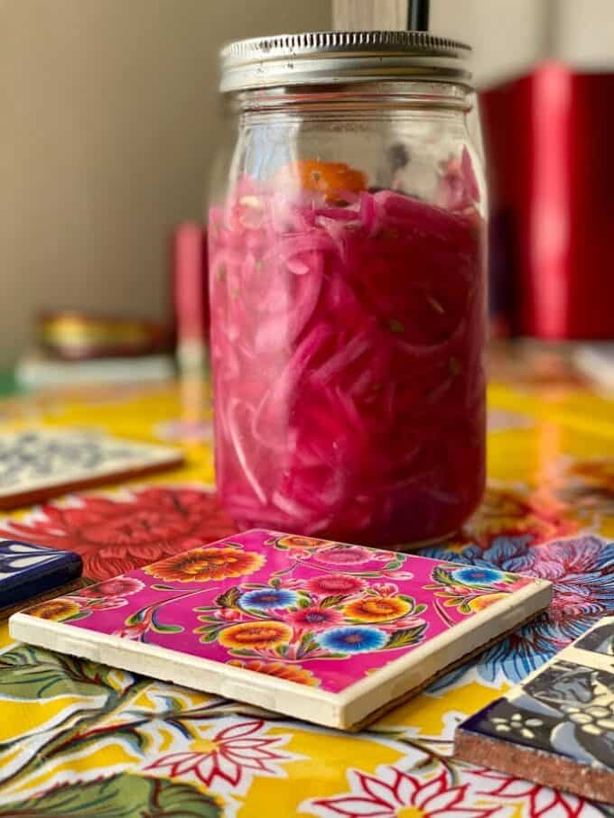 Pickled red onions in glass jar
