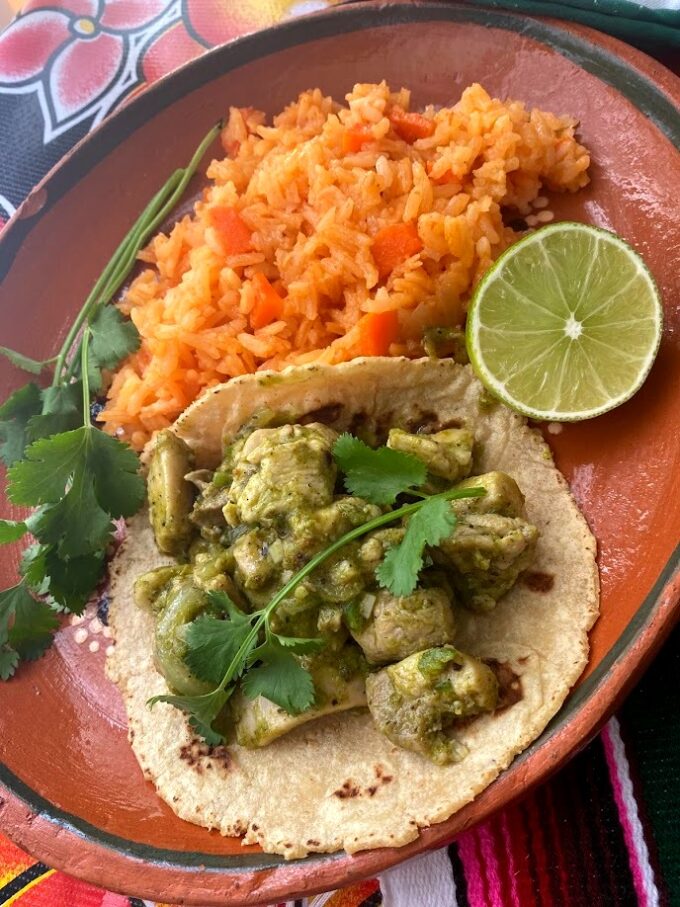 adobo verde chicken tacos served with Mexican rice