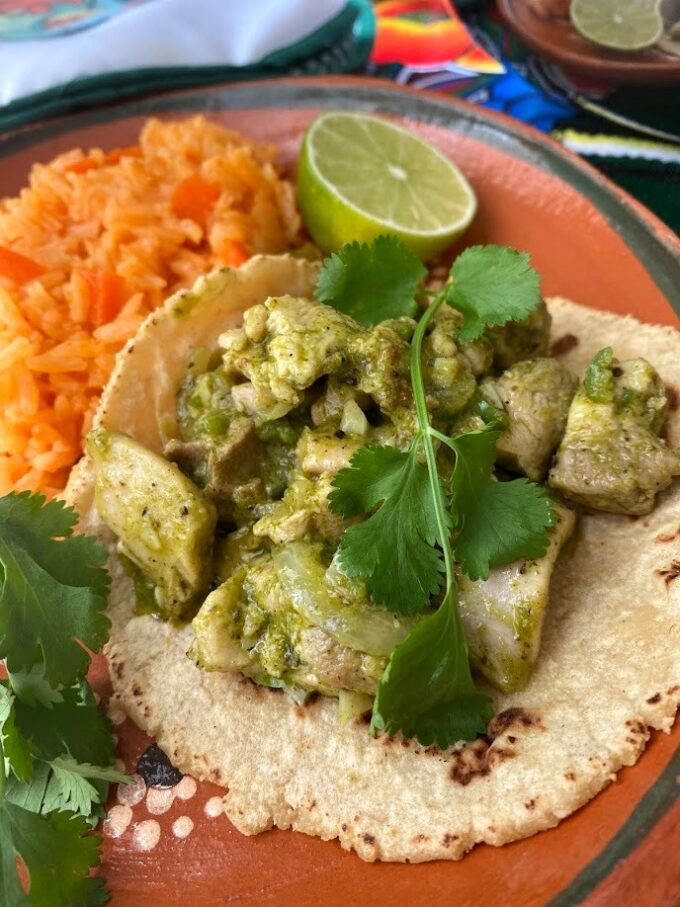 adobo verde chicken taco served with rice
