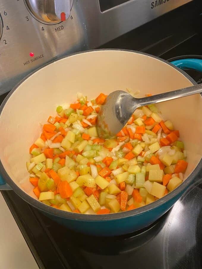 saute vegetables in large pot