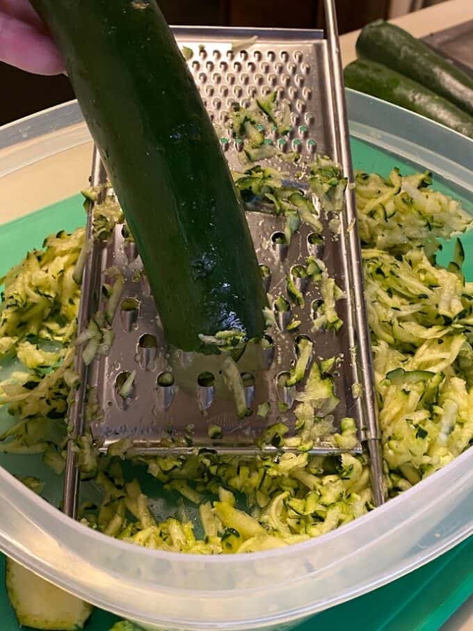 grating fresh zucchini close up