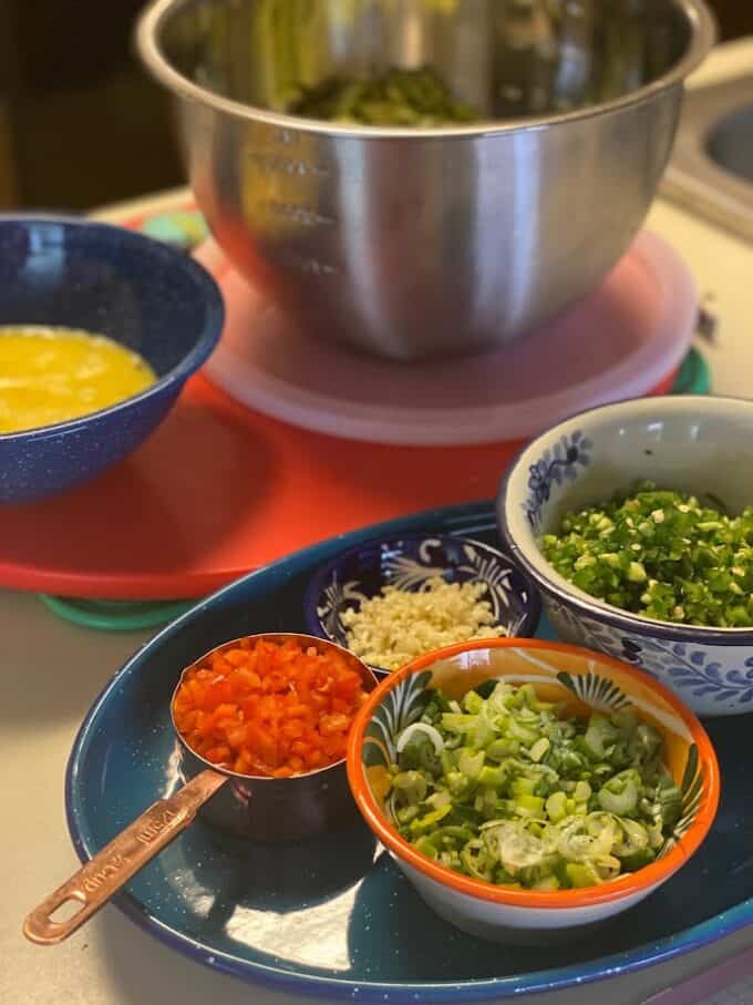 chopped and minced fresh ingredients in bowls